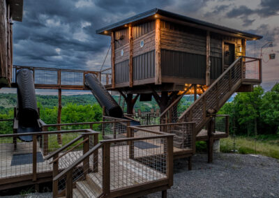 Two treehouses linked together with slides