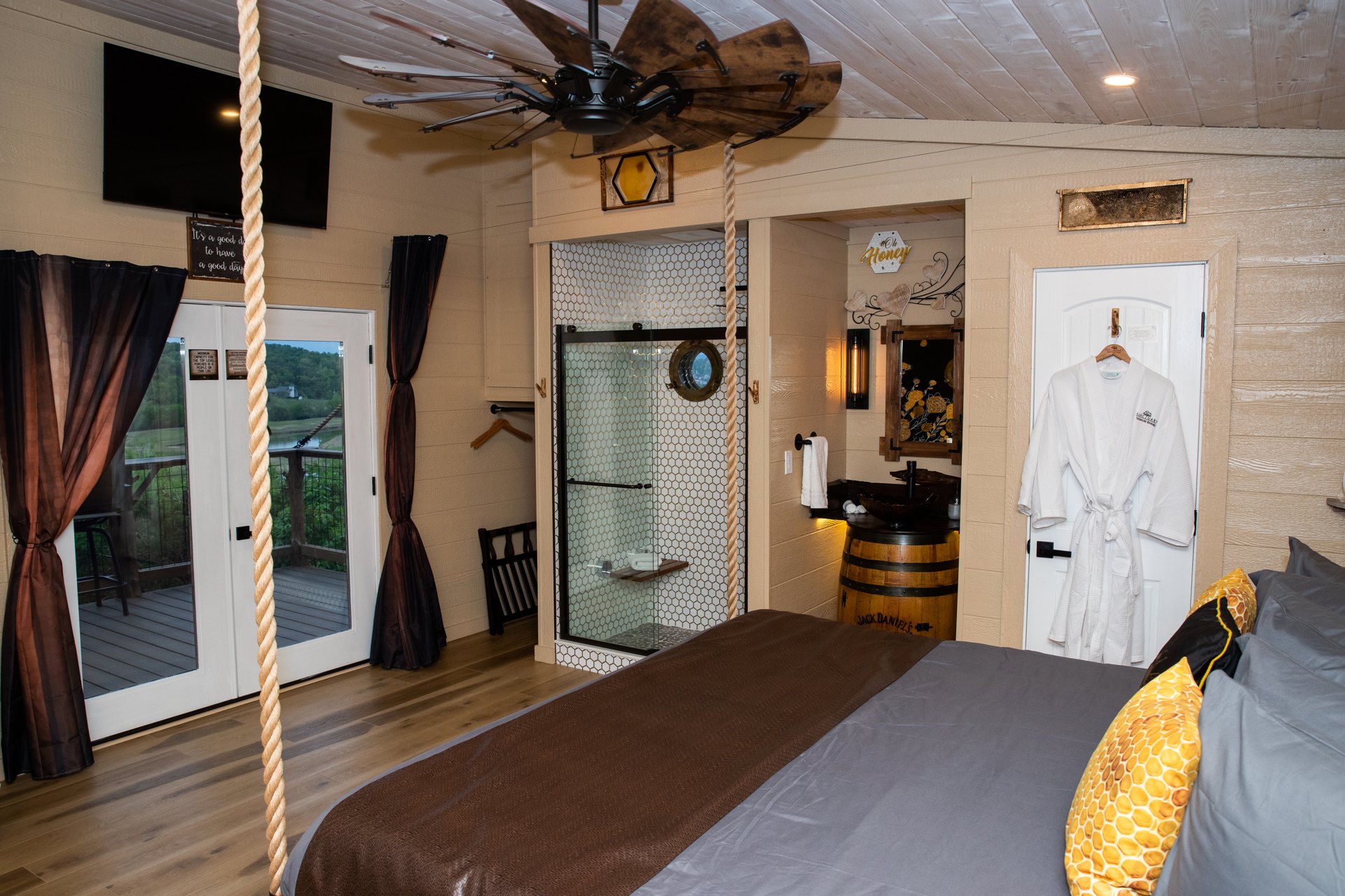 Inside a Sanctuary treehouse Treehouse resort amenities inside a Sanctuary treehouse, with a king bed and kitchenette