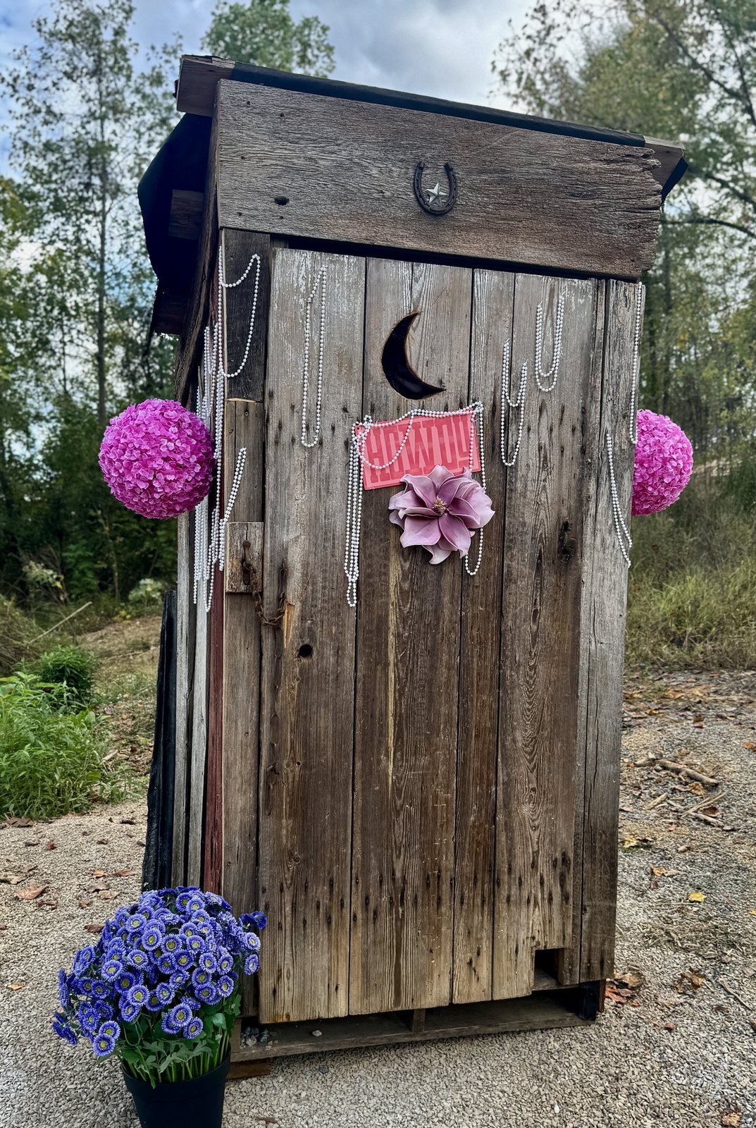 Dolly’s Closet, a weathered wooden photo stop decorated with pink pom-poms and a bow, on the one-mile interactive scavenger hunt at Sanctuary Treehouse Resort