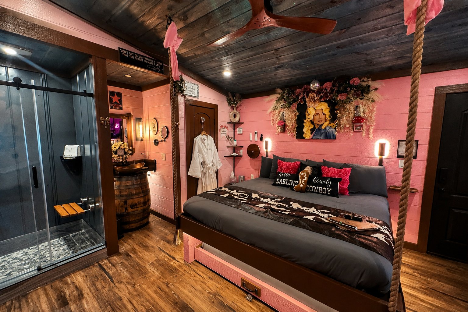 parton-my-mountains-interior Inside Parton My Mountains, a Dolly Parton treehouse near Dollywood at Sanctuary Treehouse Resort in Sevierville, Tennessee: pink walls, a framed Dolly portrait above the bed and a glass shower